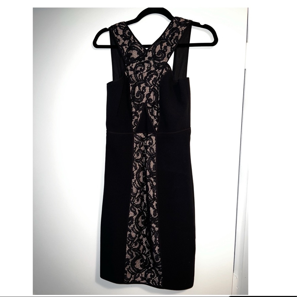 Gently used BCBG Claudine lace paneled black cocktail dress size 2.